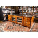 An English neoclassical leather-topped mahogany library desk with gilt bronze mounts, 19th C.