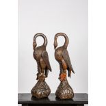 A pair of polychrome wooden flamingos, 20th C.