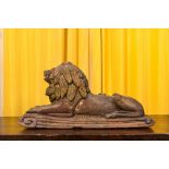 A painted wooden model of a recumbent lion, 19th C.