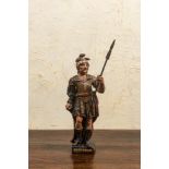 A polychrome wooden sculpture of a Roman soldier, 17/18th C.