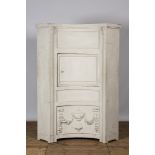 A neoclassical whitewashed corner cabinet, 19th C.