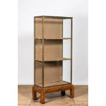 A French brass display cabinet on Asian wooden stand, 20th C.