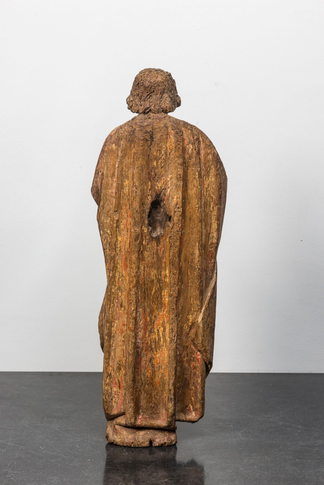 A Flemish oak figure of Saint John with traces of polychromy, 16th C. - Image 2 of 3