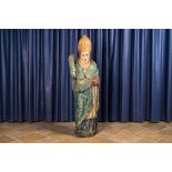 A polychrome wooden figure of a bishop, 16th C.