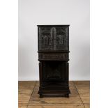 A neoclassical ebonised wooden cabinet on foot with an interior with parquetry and polychrome design