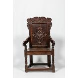 An English walnut and oak wooden armchair, 18th C.