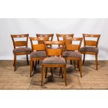Seven oak wooden dining room chairs, 1st half 20th C.
