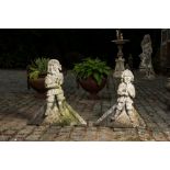 A pair of carved stone roof ornaments with historical warriors, 19th C.