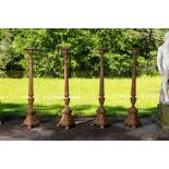 Four large cast iron church candlesticks, 20th C.