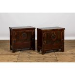 A pair of Chinese lacquered elm cabinets, 20th C.