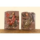 A pair of polychrome wooden reliefs depicting saints, 17th C.