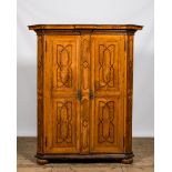 A German walnut veneered two-door marquetry cupboard, 18th C.