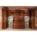 An imposing walnut sacristy cupboard with floral design and garlands, 18th C.