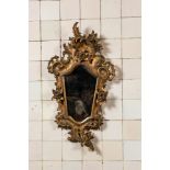 A French finely carved gilt wooden Louis XV-style rocaille mirror with roses, 18/19th C.