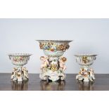 Three reticulated porcelain footed baskets with putti, Plaue Schierholz, Germany, early 20th C.