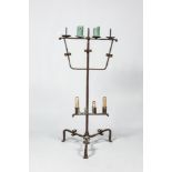 A large wrought iron candlestick, 15th C. or later