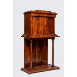 A neoclassical mahogany cabinet on stand, 19th C.