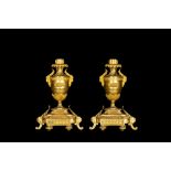 A pair of French gilt bronze Empire-style candlesticks, 19th C.