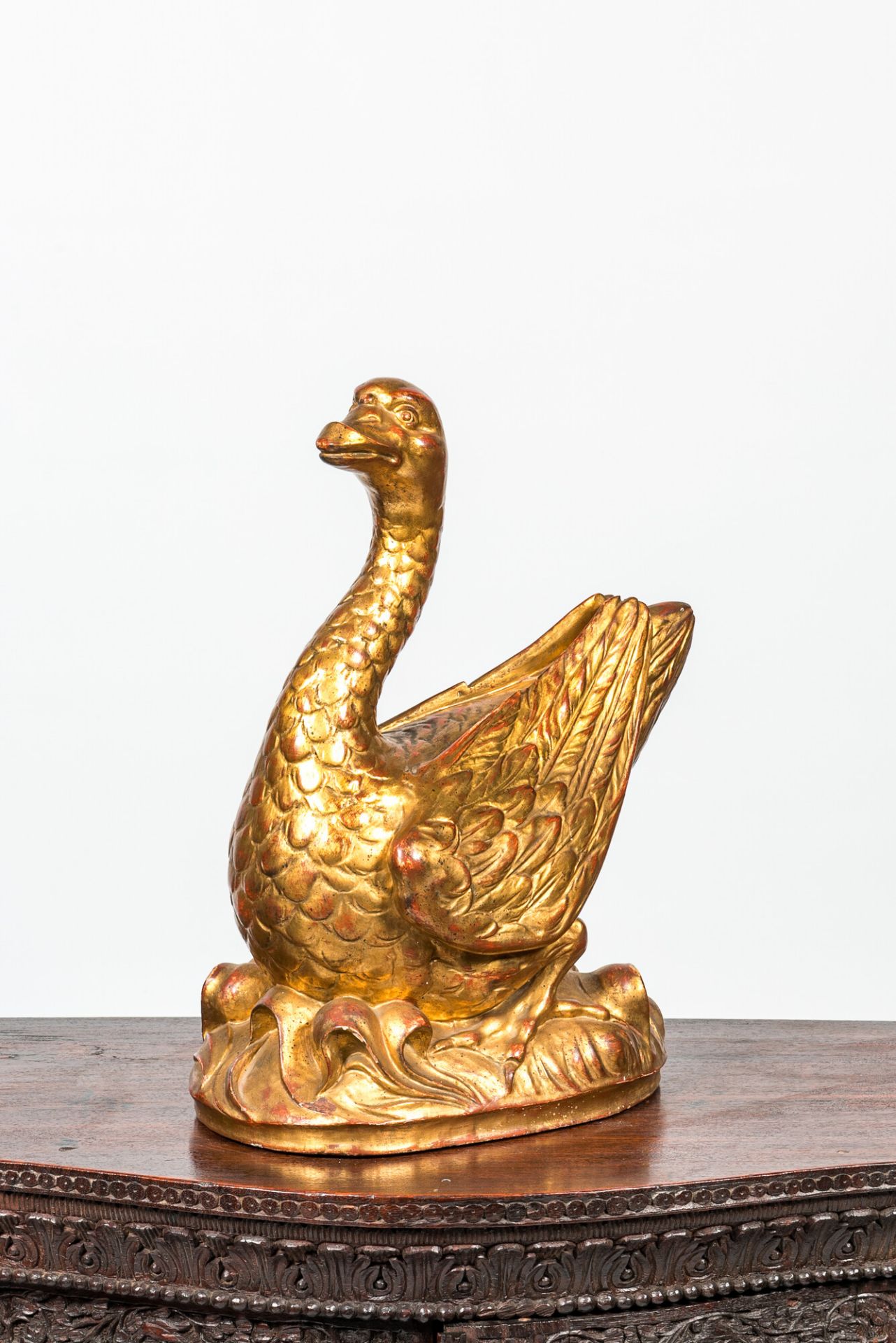 A French gilt and lacquered wooden goose, 19th C.