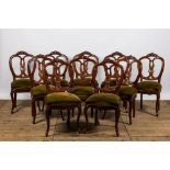 A set of ten French wooden chairs with green velvet upholstery, 19th C.