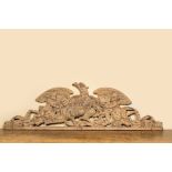 A large leached oak relief depicting an eagle slaying a serpent and two angels, 18th C.