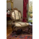 An Italian gilt carved wooden Louis XV armchair upholstered with silver brocade, 18th C.