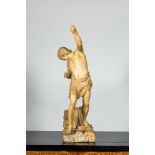 A patinated plaster sculpture of a young man on a raft, 20th C.