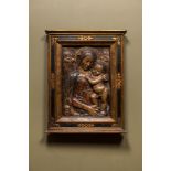 An Italian polychrome stucco relief with Madonna with Child, possibly Florence, 16/17th C.