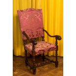 A wooden armchair with red velvet lining, 18th C.