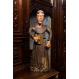 A polychrome wooden sculpture of a monk, 17/18th C.