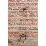 A large wrought iron candlestick, 19th C.