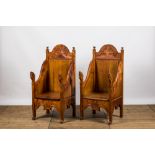 A pair of English carved wooden 'Arts and Crafts'-style chairs, 20th C.