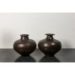 Two vases composed of riveted cast iron panels, 20th C.