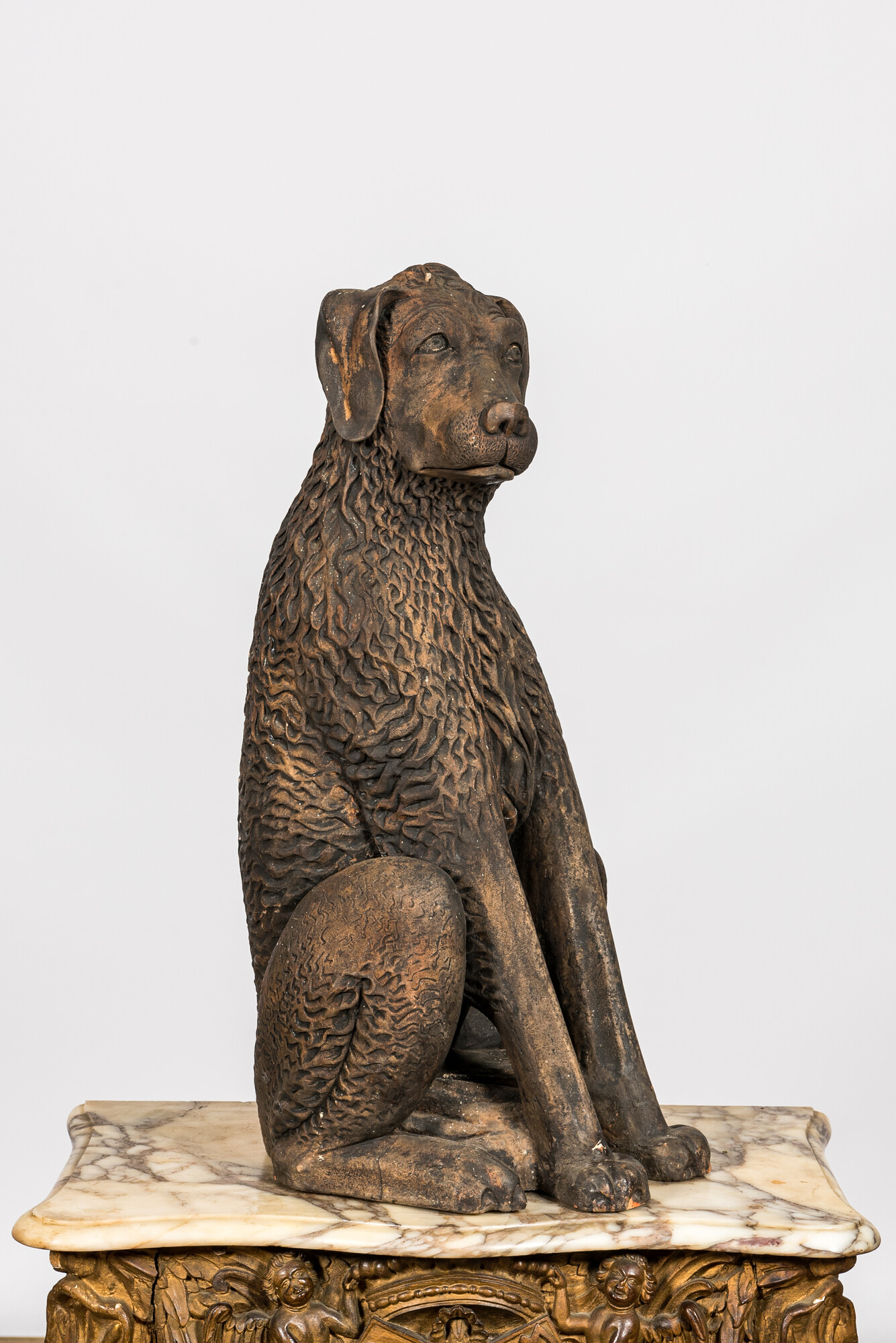 A patinated terracotta 'dog' sculpture, 19th C. - Image 2 of 2