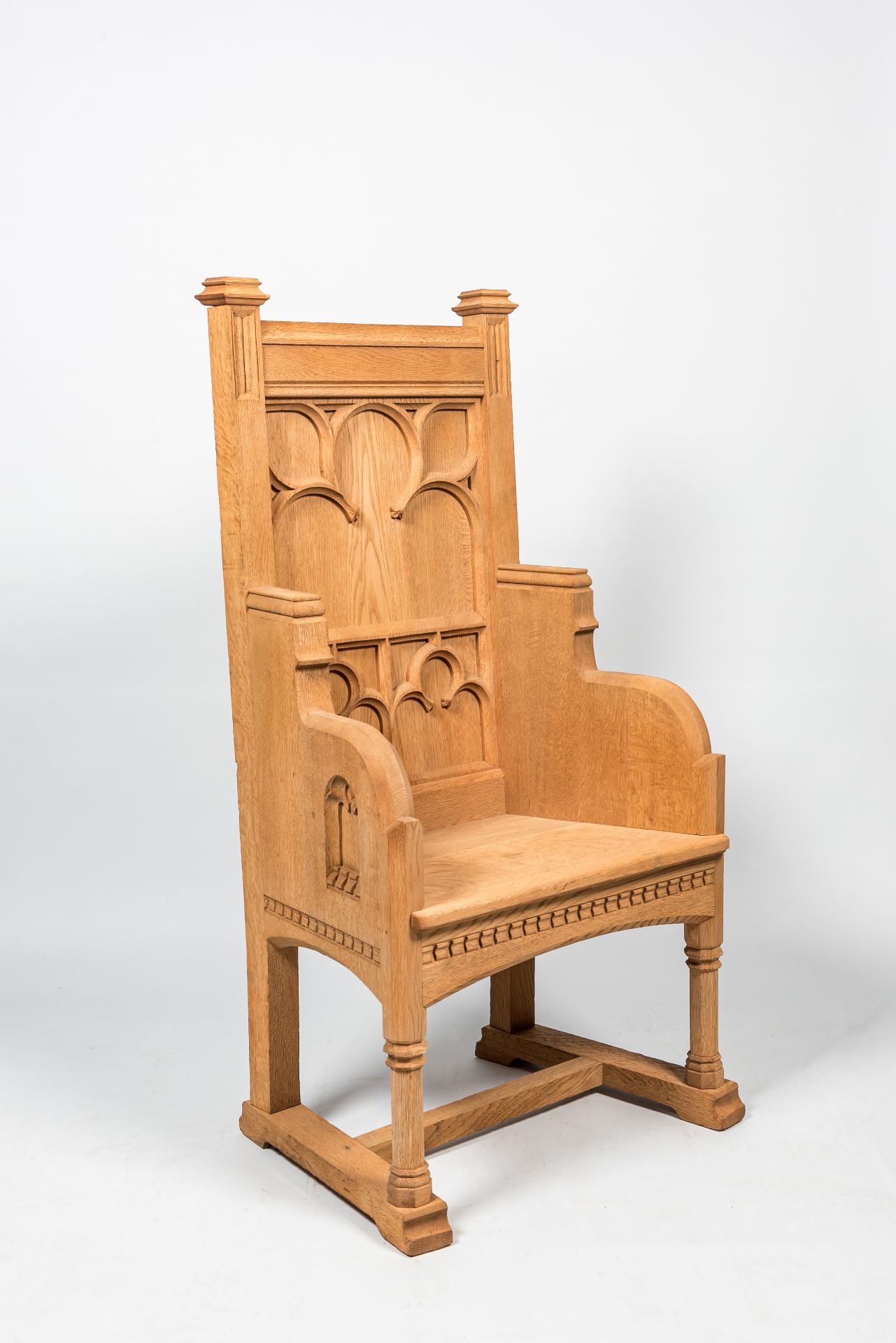 A French Gothic Revival white oak wooden armchair, 20th C.