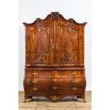 A Dutch mahogany veneered cabinet with two doors and three drawers, 18th C.