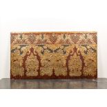 A Spanish rectangular panel of embossed gilt leather wallpaper, signed Meryan, Cordoba, 20th C.