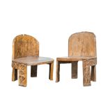 A pair of African carved wooden chairs in Eket-style, 20th C.