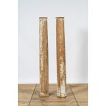 A pair of partly patinated wooden columns, 19th C.