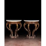 A pair of French partly gilt wooden consoles with marble top, 19th C.