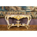 An attractive partly gilt wooden console table with marble top, Italy, 19th C.