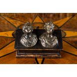 A pair of Italian patinated bronze miniature busts mounted on a later ebonised wooden stand, 17th C.