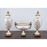 A French Limoges porcelain three-piece garniture with floral and gilt design, 20th C.