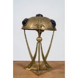 An Art Nouveau brass lamp with coloured cabochons, 20th C.