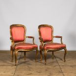 Two French Louis XV-style gilt wooden upholstered armchairs, 19th C.