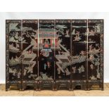 A Chinese lacquered six-part folding screen with a narrative 'immortals' scene, 20th C.