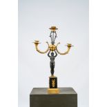 A French gilt and patinated bronze three-light candelabra, 19th C.