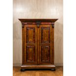 A Flemish wooden two-door cupboard with tortoiseshell and ebonised accents, 17th C. and later