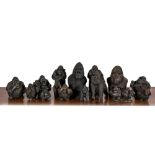 A large collection of wooden and polystone gorilla sculptures, 20th C.