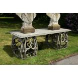 An impressive exterior table with bluestone top on entwined polyester antlers, 20th C.